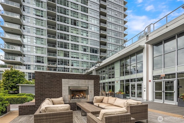 exterior space featuring an outdoor living space with a fireplace