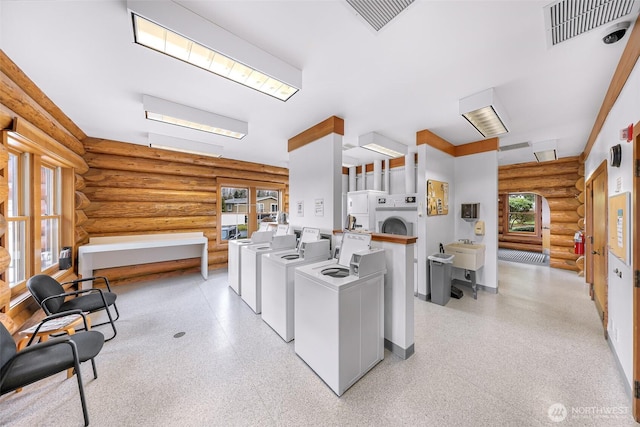 washroom featuring sink and separate washer and dryer