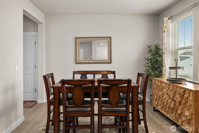 dining space featuring light hardwood / wood-style flooring