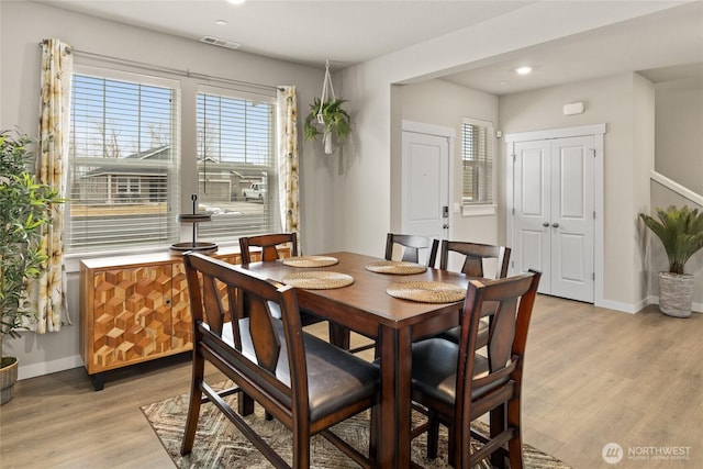 dining room with light hardwood / wood-style floors