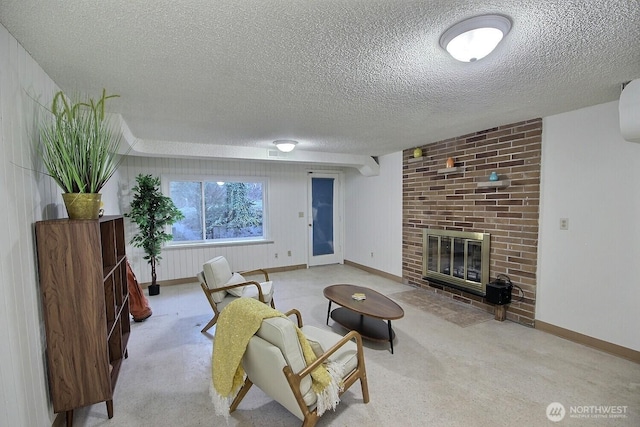 carpeted living room with a textured ceiling and a fireplace