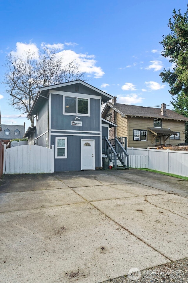 exterior space featuring stairs and fence