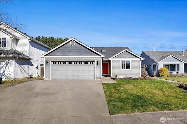 view of front of property featuring an attached garage, concrete driveway, and a front lawn