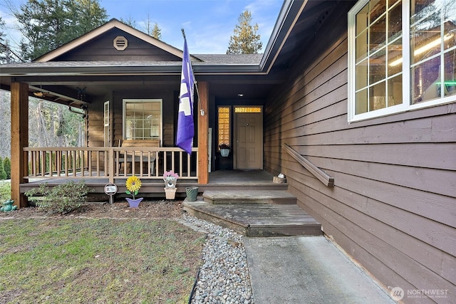 view of exterior entry with covered porch