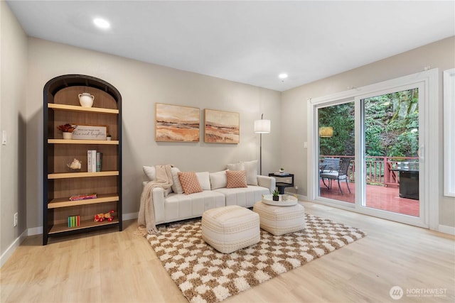 living room with light hardwood / wood-style flooring