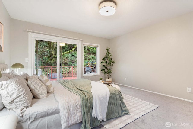 carpeted bedroom with access to outside