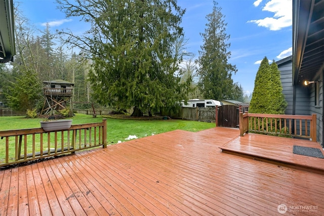 wooden deck with a lawn