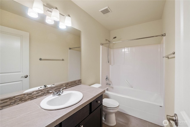 bathroom featuring visible vents,  shower combination, toilet, and vanity