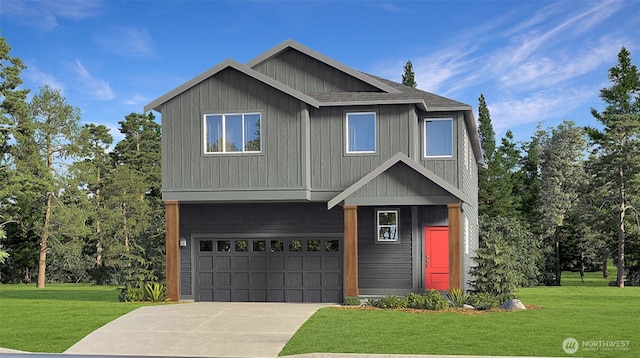 view of front of house featuring a front lawn and a garage