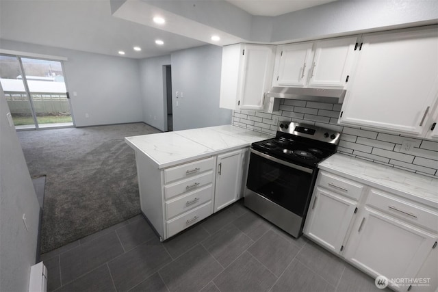 kitchen featuring white cabinets, electric stove, a peninsula, dark colored carpet, and under cabinet range hood