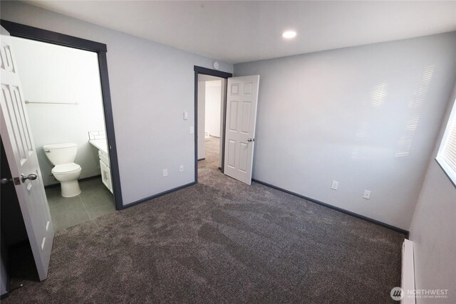 unfurnished bedroom featuring recessed lighting, carpet flooring, baseboards, and ensuite bathroom