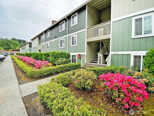 view of property featuring stairway