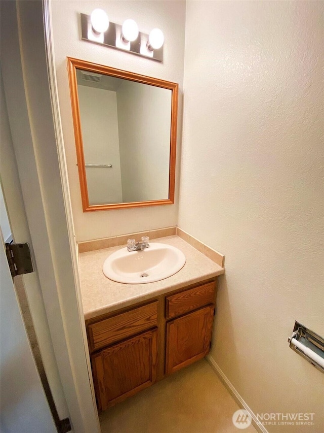 bathroom with visible vents and vanity