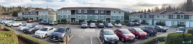 uncovered parking lot featuring a residential view