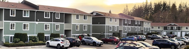 parking at dusk with uncovered parking and a residential view