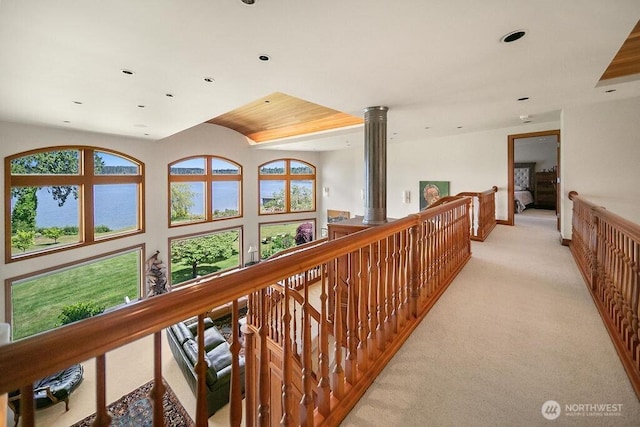 hall with an upstairs landing, recessed lighting, and light colored carpet