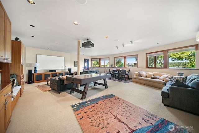 living area featuring recessed lighting and light colored carpet