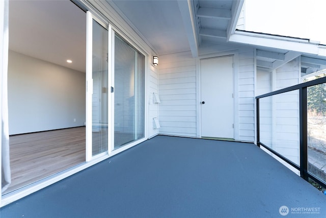 view of patio featuring a balcony