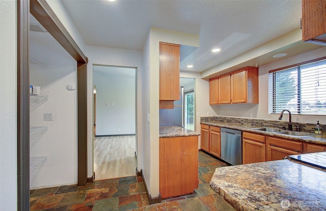 kitchen featuring dishwasher and sink