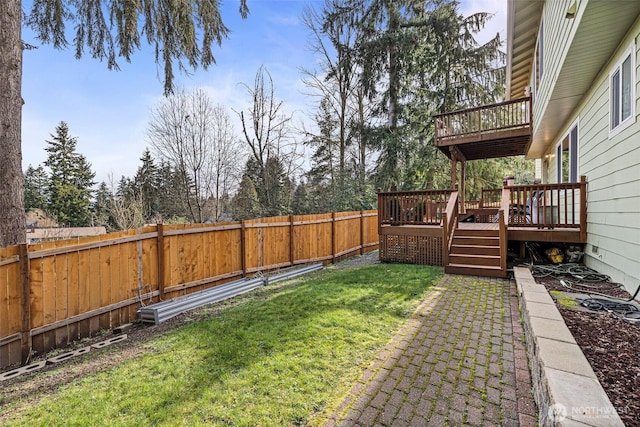 view of yard with a fenced backyard and a deck