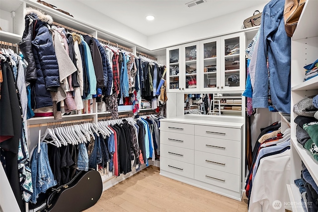 spacious closet with light wood finished floors and visible vents