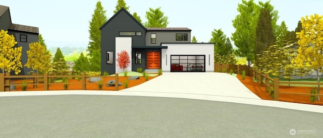 view of front of home with a garage, a fenced front yard, and concrete driveway