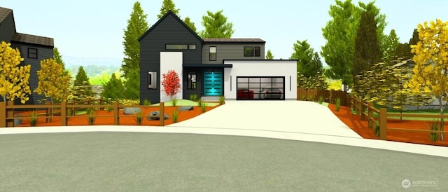 exterior space featuring a garage, driveway, and a fenced front yard