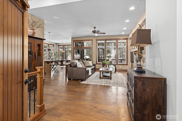 living room featuring ceiling fan, wood finished floors, and recessed lighting