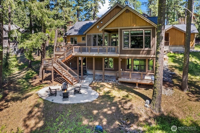 262 Black Nugget Ln, Cle Elum, WA 98922 - back of house featuring a patio area, a deck, stairway, an outdoor fire pit, and a lawn