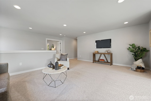 sitting room with carpet floors, baseboards, and recessed lighting