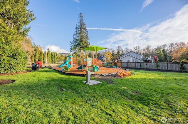 community playground with fence and a yard