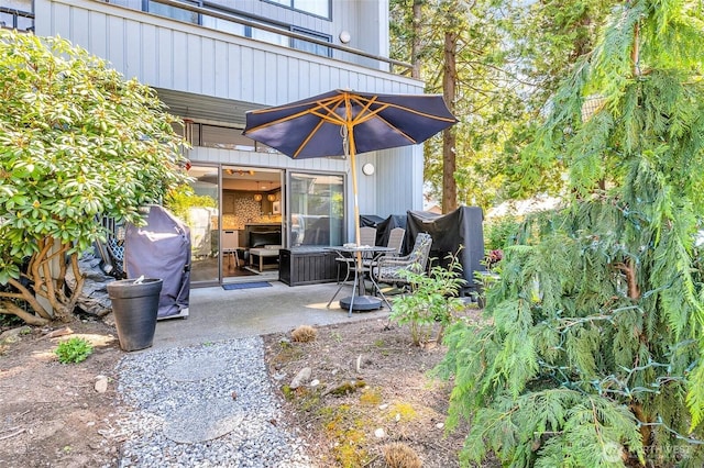 view of patio / terrace with area for grilling and a balcony