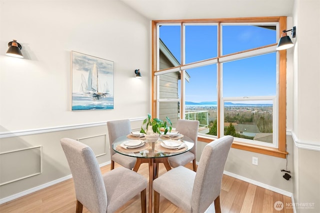 dining area with wood finished floors and baseboards