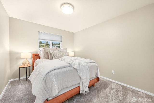 carpeted bedroom with baseboards