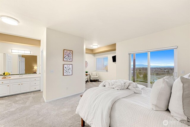 bedroom featuring light carpet and access to outside