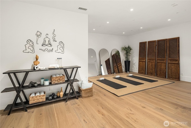 workout room with light wood-type flooring