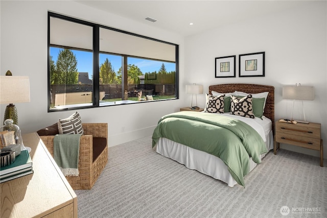 bedroom featuring light colored carpet