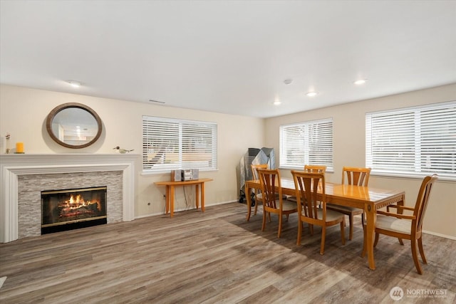 dining space with hardwood / wood-style flooring