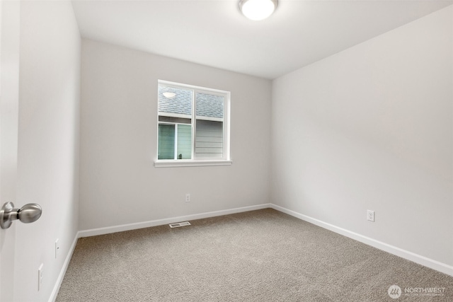 spare room featuring carpet floors