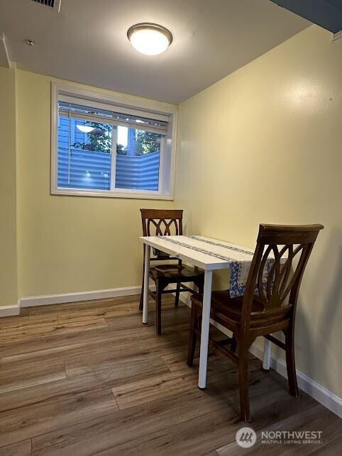 dining room with hardwood / wood-style floors