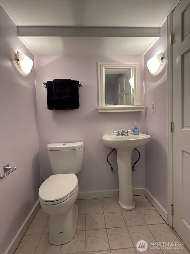 bathroom featuring sink and toilet