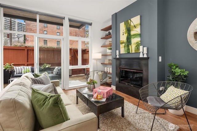 interior space featuring a glass covered fireplace