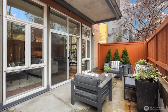 view of patio / terrace featuring fence private yard and an outdoor living space