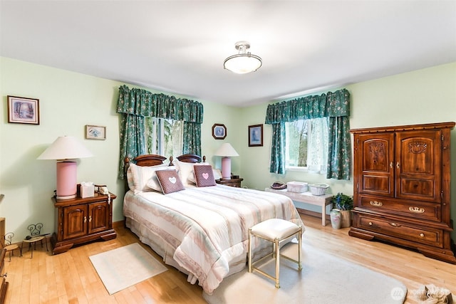 bedroom with light hardwood / wood-style floors