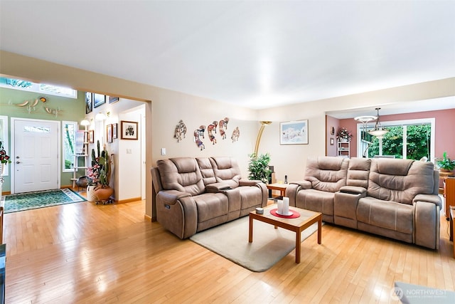 living room with light hardwood / wood-style floors