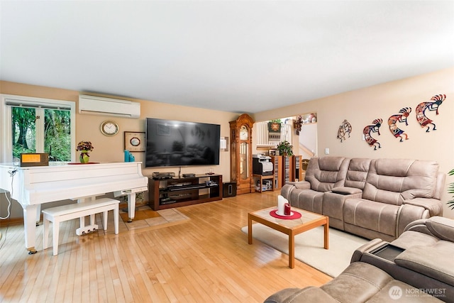 living room with light wood-type flooring and a wall mounted AC