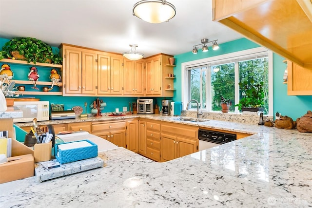 kitchen featuring sink, light brown cabinetry, light stone countertops, and dishwasher