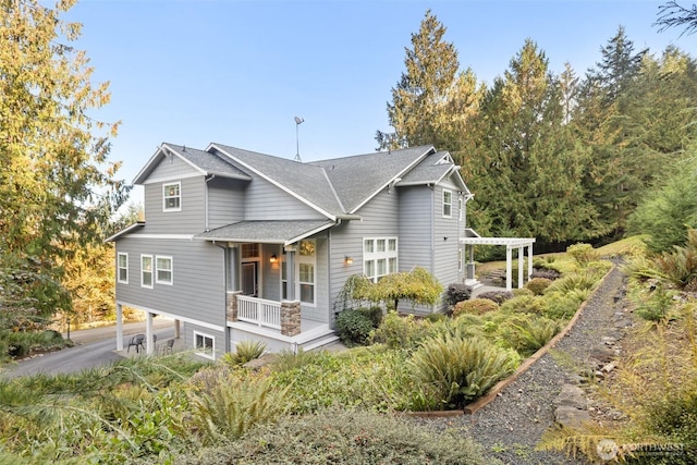 view of front of property with a pergola