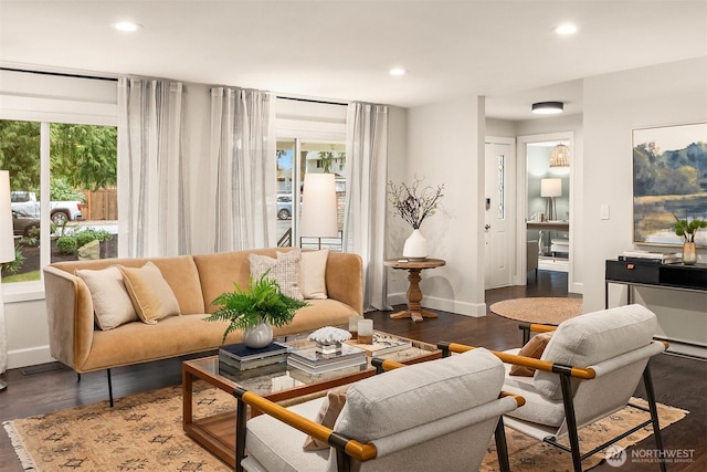 living room with baseboards, dark wood-style flooring, visible vents, and recessed lighting