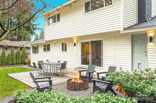 exterior space with an outdoor fire pit